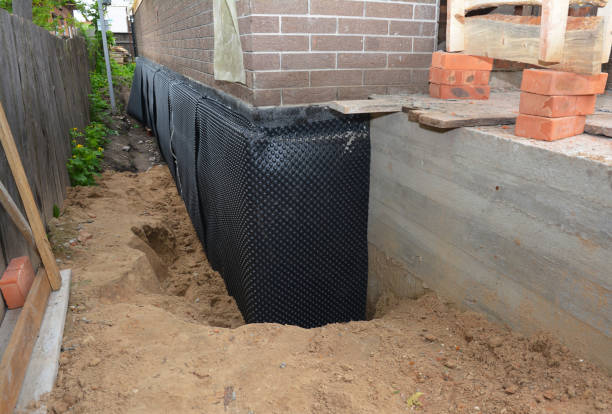 Happy homeowners after waterproofing job in Marinette